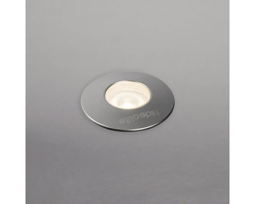Infälld spot med rund form och silverfärgad ram.
