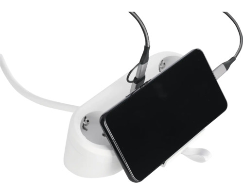 Laddstation med mobiltelefon och laddkabel