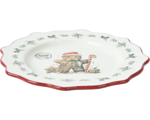 Tallrik med pepparkaksmotiv och röd kant för juldekorationer.