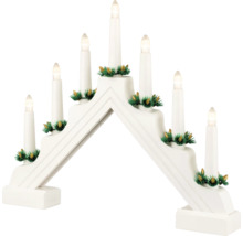 Adventsljusstake med sju ljus och kotte-dekoration.