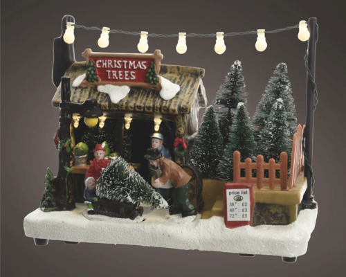 Julmarknadsscen med figurer, julgranar och belysning