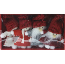 Juldekoration med fyra tomtefigurer i en låda