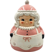 Dekorativ förvaringsburk i juldesign av en kvinna