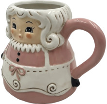 Keramisk mugg med kvinnofigur och handtag