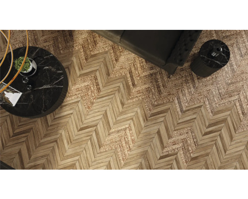 Vyisning av ett rum med fiskbensparkett och möbler