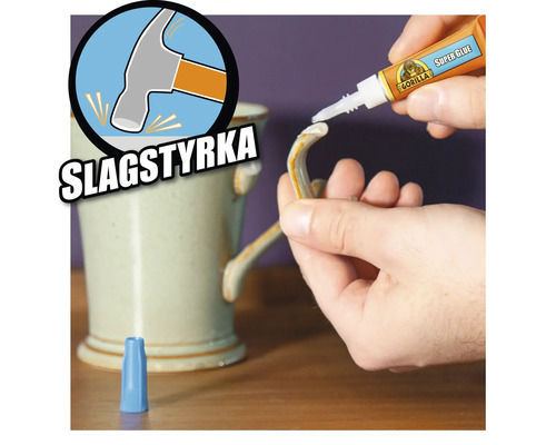 Superlim appliceras på en trasig keramikmugg. Symbol för slagtålighet.