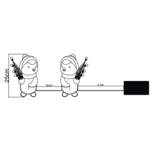 Bild av en ljusslinga med pingvinmotiv och måttangivelser