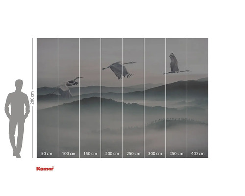 Fototapet med tranor som flyger över ett bergslandskap