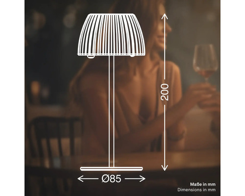 Teknisk ritning av en bordslampa med måtten 200 millimeter hög och 85 millimeter i diameter mot en suddig bakgrund.